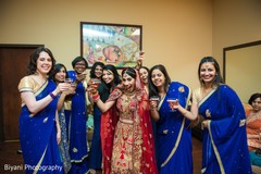Indian bride having a drink with bridesmaids Indian bride having a drink with bridesmaids