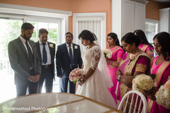 Indian bride with family and bridesmaids making a prayer Indian bride with family and bridesmaids making a prayer