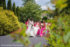 Indian bride walking with bridesmaids Indian bride walking with bridesmaids