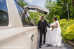 Indian bride getting inside wedding limousine Indian bride getting inside wedding limousine