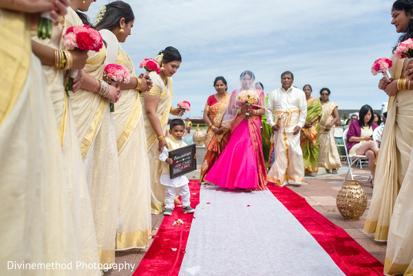 Dazzling indian bride walking down the aisle