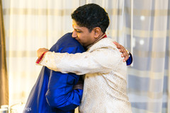 Indian groom being hugged indian groom fashion,indian groom getting ready