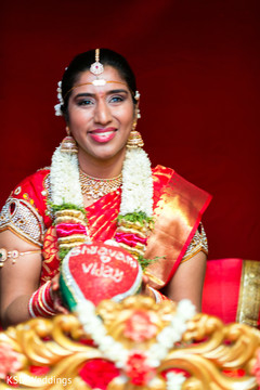 Sweet indian bride holding decorated coconut indian wedding ceremony,indian bride fashion,bridal jewelry