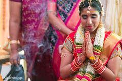 Adorable indian bride praying indian wedding ceremony,indian bride,indian wedding ceremony photography