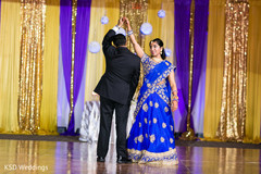 Indian lovebirds having their first dance indian wedding reception,indian wedding reception photography,indian bride and groom
