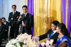 Elegant groomsman giving a speech indian wedding reception,indian wedding reception photography,indian bride and groom