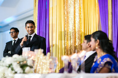 Indian groomsman giving a speech capture indian wedding reception,indian wedding reception photography,indian bride and groom