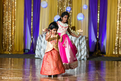 Adorable indian girls giving a dance performance indian wedding reception,indian wedding reception photography,indian wedding reception performers