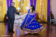 Glowing indian bride dancing indian wedding reception,indian wedding reception photography,indian bride fashion