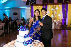 Indian bride and groom's portrait indian wedding reception,indian wedding reception photography,indian bride and groom,indian wedding cake