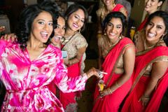 Lovely indian bride posing with bridesmaids Lovely indian bride posing with bridesmaids