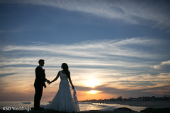 Sweet indian couple by the beach at sunset capture indian wedding gallery,indian bride and groom,outdoor photography
