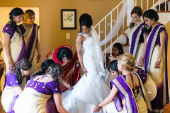 Last minute touch ups to the bride's dress. Last minute touch ups to the bride's dress.