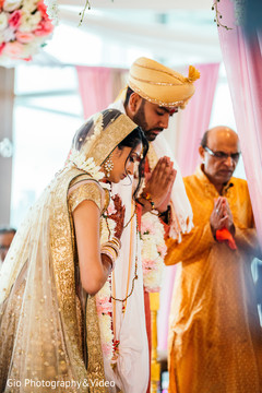 Indian bride and groom praying during ceremony indian bride and groom,indian wedding ceremony