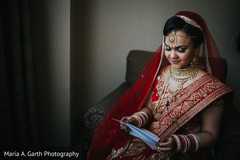 Indian bride reading a letter from the groom. Indian bride reading a letter from the groom.