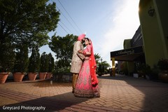Lovely indian bride and groom in matching wedding outfits Lovely indian bride and groom in matching wedding outfits