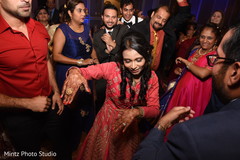 Bride showing off her moves at the dance floor. indian wedding reception,dj and entertainment