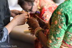Indian bride placing her bangles. indian wedding photography,indian bridal jewelry,getting ready