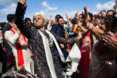 Indian groom dancing with guests Indian groom dancing with guests