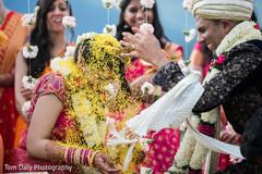 Indian groom throwing rice at the bride Indian groom throwing rice at the bride