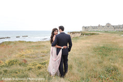 Indian couple by the Pacific Ocean coastline Indian couple by the Pacific Ocean coastline