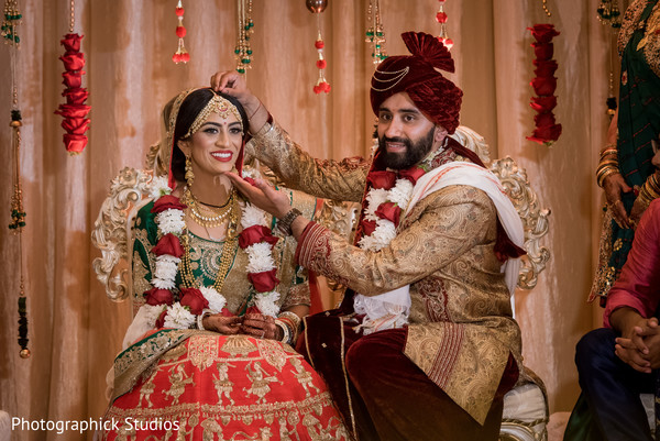 Indian groom enjoying wedding ceremony