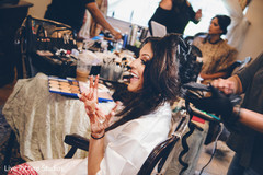 Maharani getting her makeup done getting ready,indian bride makeup,bridal hair and makeup