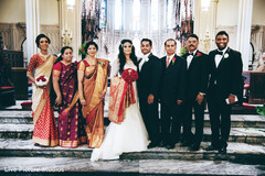 Lovely indian couple with their family indian wedding,indian fusion wedding,indian groom fashion
