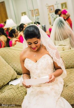 Indian bride reading her love's letter indian bride,indian bride white wedding dress