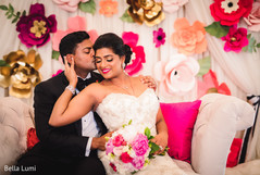 indian couple posing during their wedding celebration indian bride and groom,indian wedding reception,indian bridal bouquet