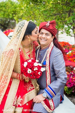 Maharani kissing the groom indian bride fashion,indian groom fashion,bridal bouquet