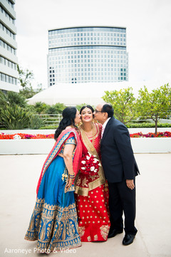 Lovely photo of indian bride with her parents blue sari,bridal lengha,suit