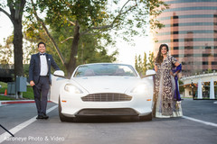 Indian newlyweds by their luxury just married car transportation,sports car,wedding car,indian wedding transportation