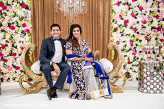 Lovely indian couple in their reception stage indian wedding reception,reception fashion,suit