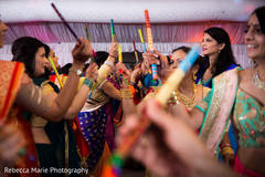 Joyful dandia raas ritual pre- wedding celebrations,indian wedding garba,garba sticks,dandia raas