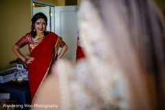 Indian bridesmaid looking at the bride Indian bridesmaid looking at the bride