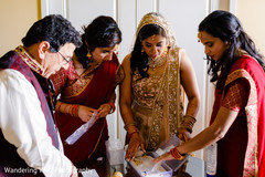 Maharani checking her jewelry set bridal lengha,indian bride fashion,indian bride jewelry