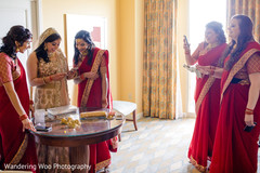 Lovely bridesmaids in red saris red sari,golden sari,getting ready