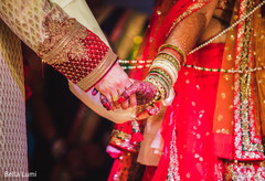 Adorable indian couple holding hands indian wedding ceremony,indian bride and groom,indian wedding ceremony photography,bridal jewelry