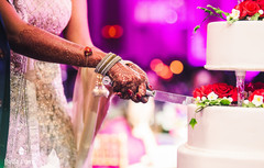 Indian wedding reception cutting the cake moment indian wedding reception,indian bride and groom,indian wedding cake