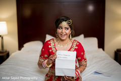 Indian bride receiving funny letter from groom indian bride getting ready,indian bride fashion,bridal jewelry