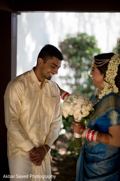 Indian lovebirds treasured moments indian bride and groom,indian bridal bouquet,bridal jewelry,first look photography