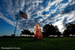 Indian bride and groom picture in a field. indian bride and groom,indian wedding photography