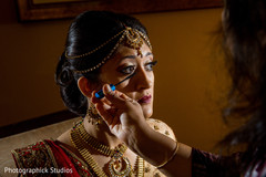 Final touch ups for this charming Indian bride. indian bride,getting ready,hair and makeup