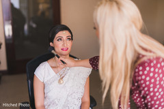 Indian bride makeup session. indian bride,getting ready,hair and makeup
