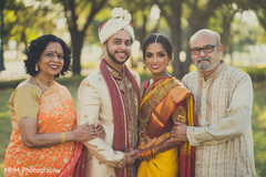 Indian bride and groom with family portrait outdoor photography,indian wedding gallery,indian bride and groom