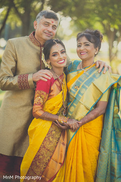 Gorgeous indian bride posing with her parents outdoor photography,indian wedding gallery,indian bride fashion