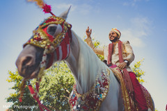 Elegant indian groom riding a white baraat horse indian wedding baraat,baraat horse,indian groom fashion