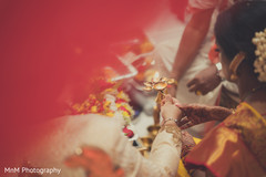 Indian bride and groom during wedding ceremony ritual Indian bride and groom during wedding ceremony ritual