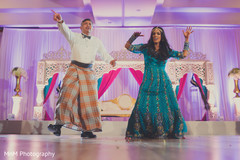 Lovely indian bride making a dance performance indian wedding reception,indian wedding reception photography,indian bride fashion